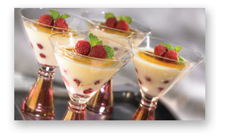 Elegant Vanilla Pudding with Raspberries and Cracked Sugar Topping